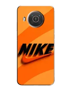 Чехол для Nokia X20 с картинкой «Оранжевый драйв Nike»